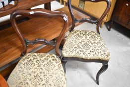 A pair of Victorian rosewood rail back dining chairs