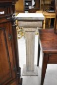 A reproduction stone effect jardinere stand