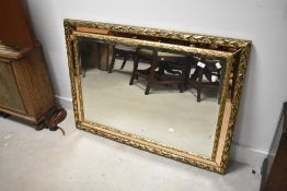 A modern gilt framed wall mirror, with copper glass border, approx. 110 x 80cm