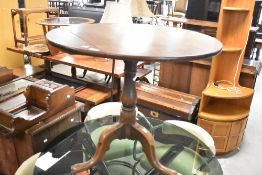 A 19th Century mahogany pedestal table having circular top on turned column and triple splay legs,