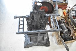A traditional cast iron figural stick stand