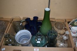 A selection of jugs, bottles and vases including a blue glass handkerchief style vase and a