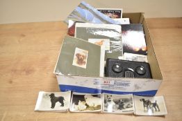 A collection of modern postcards, a vintage stereoscope and a small selection of cards and a small
