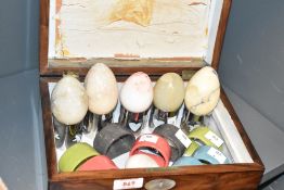 A vintage wooden box inlaid with mother of pear oval to top and front containing six assorted