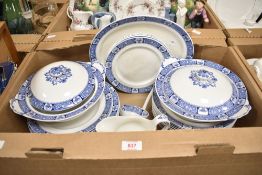 A part dinner service having a blue and white banded design consisting of plates, bowls and