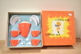 A vintage childrens play coffee set in original packaging