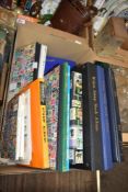 A cased set of silver plated coffee bean spoons and a small collection of assorted books including