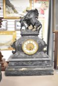 An antique French style spelter horse black marble effect clock (has sustained some damage to base)