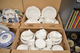 A Royal Doulton Mystique pattern dinner service, decorated with floral patterns on a white glazed