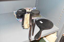 A wooden dressing table set consisting of mirror, brushes, glove stretcher and box, a ladies vintage