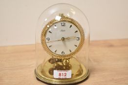 A mid - century 'Kundo' 400 day brass mantel clock with glass dome, h16