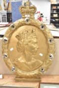 A plaster decorative wall plaque which may possibly have had lights.