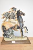 A large Capodimonte porcelain figure depicting French Hussar on horseback having damage to hat,