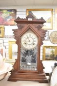 A late 19th century Ansonia (U.S.A) 'Gingerbread' clock having single gong chime and carved