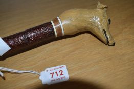 A hand carved walking stick the top depicting a lurcher approx 105cm long