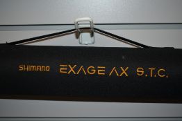 A Shimano Exage AX S.T.C boat 3050 4pc Boat rd in soft sleeve and hard travel case