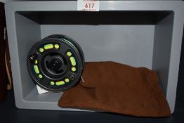 A Greys 4 and 1/4 inch GRX #9/11 fly reel in a brown canvas pouch