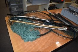 A selection of 4 landing nets of varying sizes