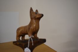 A walking stick with a carved dog in wood measuring 107cm long