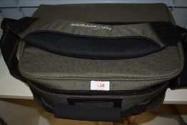 A Wilderness reel bag with 10 compartments containing 2 fly reels one Shakespeare Graphite with