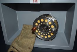 A Pflueger Trion 2858 4 and 1/8 inch fly reel