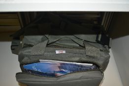 A fishing bag containing mixed tackle hooks line spinners etc
