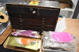 A large selection of Fly tying equipment and feathers in two boxes and a wooden chest of draws
