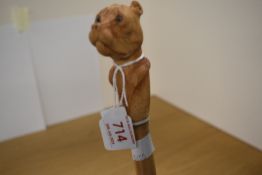 A hand carved walking cane made from bamboo and the top depicting a bull terrier approx 125cm