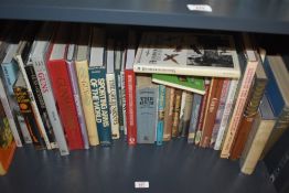 A shelf of assorted gun and cartridge related books