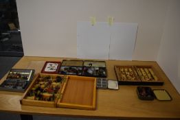 A selection of salmon and trout flies in a variety of wooden boxes, tins and plastic boxes