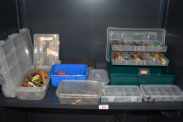 A large selection of fishing lures, minnows and spinners in assorted boxes