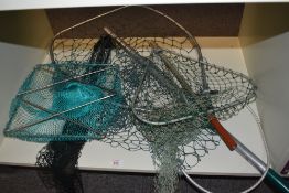 A selection of 3 landing nets of varying sizes and a small trawl or keep net
