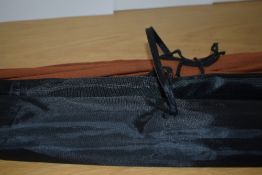 An unbranded 4pc 9ft 6in #7/8 poachers style lightweight fly rod in a black sleeve and an unmarked