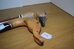 2 hand carved walking sticks depicting ducks heads approx 135cm and 140cm long