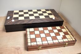 A modern games compendium set , chess and backgammon etc , and a smaller chess set
