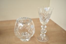 A large cut-crystal wine glass, the bowl of tapering cylindrical form with typical cut decorations