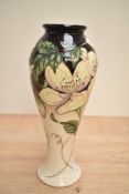 A limited edition Moorcroft pottery vase of lobed form having tube line and floral decoration,
