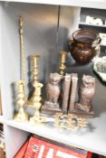 A pair of wooden bookends , owl themed, and a selection of brass ware including candlesticks and