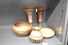 A small selection of eastern Benares type brass wares, two bowls, two flared vases and hand bell.