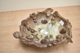 A studio pottery bowl decorated with marine life such as fish, coral and octopus, w25cm