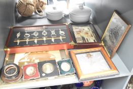 A 19th century miniature portrait of a gentleman mounted behind a gilt surround within a wooden