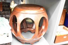 An Oriental hardwood occasional table/jardiniere stand of spherical form, height approx. 35cm