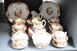 A 20th century Chinese style part tea service having gilt edging, to include two cream jugs, cups
