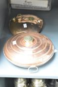 A 19th/early 20th century copper bed warmer of circular form, having brass ring handle and lid,