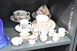 A Royal Crown Derby bone china Rougemont pattern trio, printed puce factory marks to base, sold