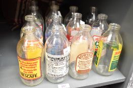 A quantity of vintage glass bottles, to include a Nescafe, Cadbury's Drinking Chocolate and Brooke