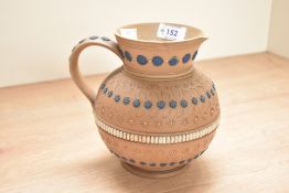 A Doulton Lambeth Silicon Ware jug, having floral patterns and impressed mark to base, h17cm
