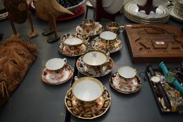 A Royal Crown Derby part tea service comprising of 8 cups and 7 saucers