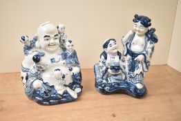 Two blue and white ornamental figures, Buddah etc