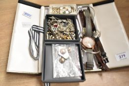 An assortment of costume jewellery, including a vintage marcasite floral scroll necklace, a Radley